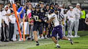 Sep 6, 2025; Orlando, Florida, USA; UCF Knights quarterback Davi Belfort (10) is forced out of bounds by North Carolina A&T Aggies cornerback PeeWee Jones (29) during the second half at Acrisure Bounce House. Mandatory Credit: Mike Watters-Imagn Images