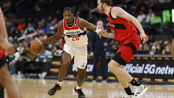 Oct 11, 2024; Washington, District of Columbia, USA; Washington Wizards forward Alex Sarr (20) drives to the basket as Toronto Raptors center Jakob Poeltl (19) in the second quarter at Capital One Arena. Mandatory Credit: Geoff Burke-Imagn Images