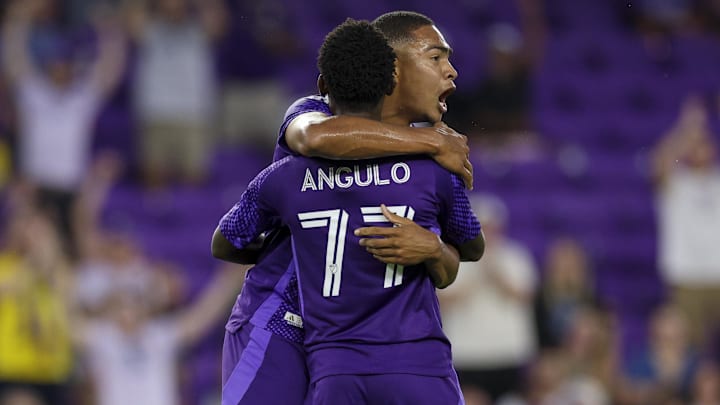 Apr 22, 2026; Orlando, Florida, USA; Orlando City SC midfielder Luis Otavio (5) reacts after scoring a goal with midfielder Ivan Angulo (77) against Charlotte FC in the first half at Inter&Co Stadium. Mandatory Credit: Nathan Ray Seebeck-Imagn Images