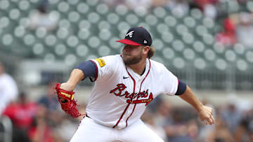 Aug 4, 2024; Cumberland, Georgia, USA; Atlanta Braves relief pitcher A.J. Minter (33) pitches during a game against the Miami Marlins in the ninth inning at Truist Park. Mandatory Credit: Mady Mertens-Imagn Images