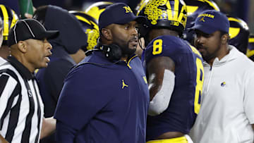 Aug 30, 2025; Ann Arbor, Michigan, USA;  Michigan Wolverines head coach Sherone Moore reacts on the sideline in the second half against the New Mexico Lobos at Michigan Stadium. Mandatory Credit: Rick Osentoski-Imagn Images