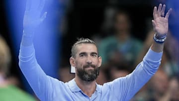 Jul 28, 2024; Nanterre, France; Michael Phelps waves to the crowd ahead of the night round of competition during the Paris 2024 Olympic Summer Games at Paris La Défense Arena. Mandatory Credit: Grace Hollars-Imagn Images