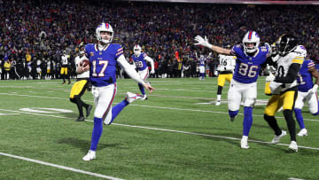 Buffalo Bills quarterback Josh Allen (17) runs into the end zone on this 52 yard run.