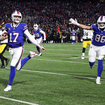 Buffalo Bills quarterback Josh Allen (17) runs into the end zone on this 52 yard run.