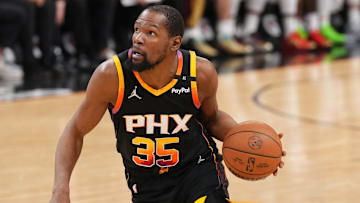 Mar 21, 2025; Phoenix, Arizona, USA; Phoenix Suns forward Kevin Durant (35) dribbles against the Cleveland Cavaliers during the second half at Footprint Center. Mandatory Credit: Joe Camporeale-Imagn Images