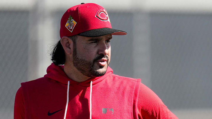 Cincinnati Reds infielder Eugenio Suarez (28) stands by between rounds of a bunting routine at the Cincinnati Reds player development complex in Goodyear, Ariz., on Thursday, Feb. 12, 2026.