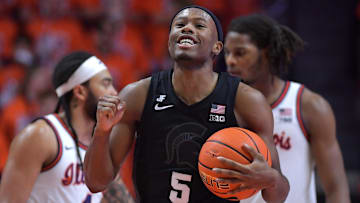 Feb 15, 2025; Champaign, Illinois, USA;  Michigan State Spartans guard Tre Holloman (5) reacts after a win over the Illinois Fighting Illini at State Farm Center. Mandatory Credit: Ron Johnson-Imagn Images