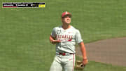 Arkansas pitcher Gage Wood points to his jersey after completing a no-hitter.