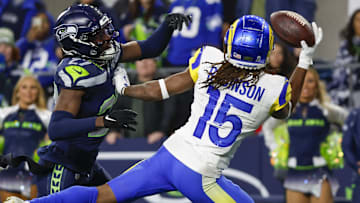 Nov 3, 2024; Seattle, Washington, USA; Los Angeles Rams wide receiver Demarcus Robinson (15) catches a game-winning touchdown pass against Seattle Seahawks cornerback Riq Woolen (27) during overtime at Lumen Field. Mandatory Credit: Joe Nicholson-Imagn Images