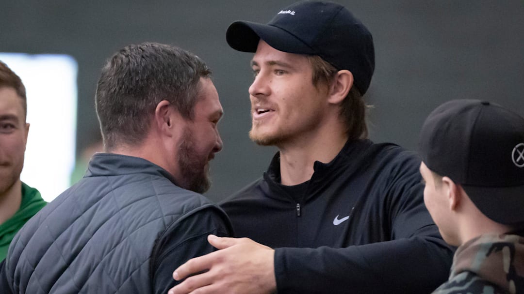 Oregon head coach Dan Lanning, left, hugs Los Angeles Chargers quarterback and former Oregon quarterback Justin Herbert during the Oregon football’s Pro Day Tuesday, March 18, 2025, at the Moshofsky Center in Eugene, Ore.