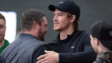 Oregon head coach Dan Lanning, left, hugs Los Angeles Chargers quarterback and former Oregon quarterback Justin Herbert during the Oregon football’s Pro Day Tuesday, March 18, 2025, at the Moshofsky Center in Eugene, Ore.