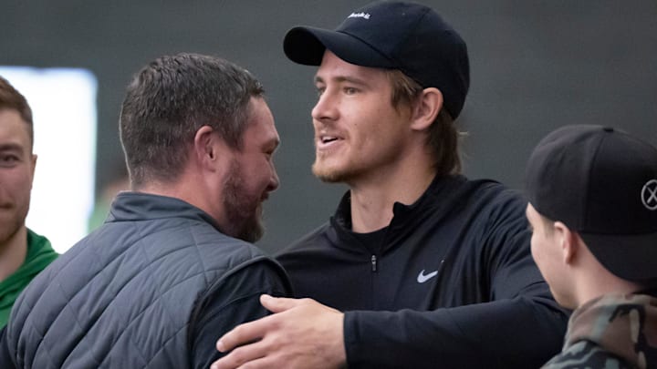 Oregon head coach Dan Lanning, left, hugs Los Angeles Chargers quarterback and former Oregon quarterback Justin Herbert during the Oregon football’s Pro Day Tuesday, March 18, 2025, at the Moshofsky Center in Eugene, Ore.