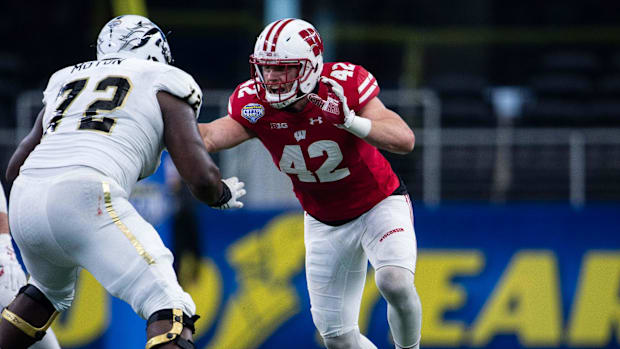 Western Michigan Broncos offensive lineman Taylor Moton (72) and Wisconsin Badgers linebacker T.J. Watt (42) in action