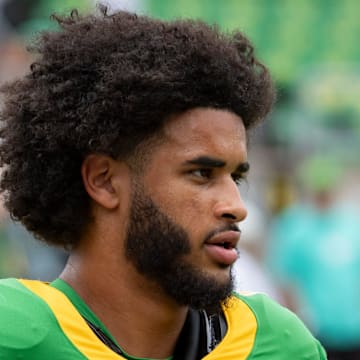 Oregon Quarterback Dante Moore Iowa hawkeyes ducks big ten playoff heisman classy pray teammate leader dan lanning injury