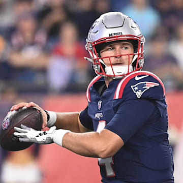 Aug 15, 2024; Foxborough, MA, USA; New England Patriots quarterback Bailey Zappe (4) looks to pass during the second half against the Philadelphia Eagles at Gillette Stadium. Mandatory Credit: Eric Canha-Imagn Images