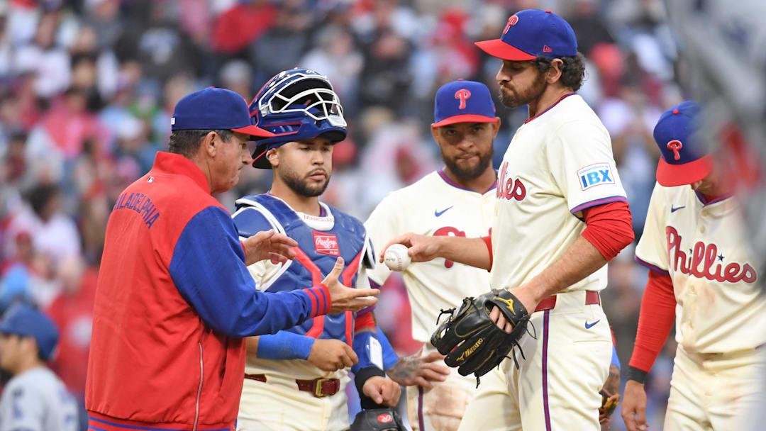 Apr 6, 2025; Philadelphia, Pennsylvania, USA; Philadelphia Phillies pitcher Jordan Romano (68) hands the ball to  manager Rob Thomson (59) after being removed from the game during the seventh inning against the Los Angeles Dodgers at Citizens Bank Park. Mandatory Credit: Eric Hartline-Imagn Images