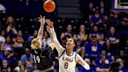 Nov 8, 2024; Baton Rouge, Louisiana, USA;  LSU Lady Tigers forward Jersey Wolfenbarger (8) blocks a shot by Northwestern State Lady Demons guard Sharna Ayres (19) during the first half at Pete Maravich Assembly Center. Mandatory Credit: Stephen Lew-Imagn Images