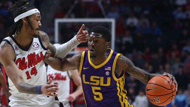 LSU Tigers guard Cam Carter (5) drives to the basket 