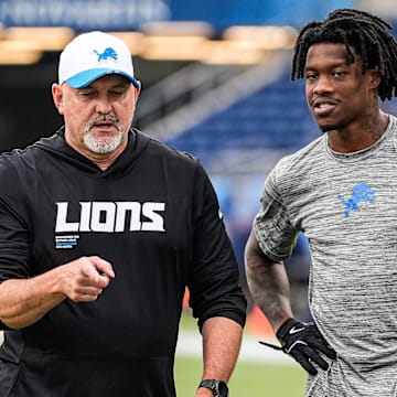 Detroit Lions offensive coordinator John Morton, left, talks to wide receiver Jameson Williams (1) at warm up ahead of the Hall of Fame Game at Tom Benson Hall of Fame Stadium in Canton, Ohio on Thursday, July 31, 2025.