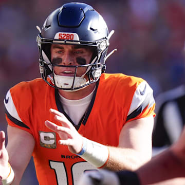 Nov 16, 2025; Denver, Colorado, USA;  Denver Broncos quarterback Bo Nix (10) takes the snap during the first quarter of the game against the Kansas City Chiefs at Empower Field at Mile High. 