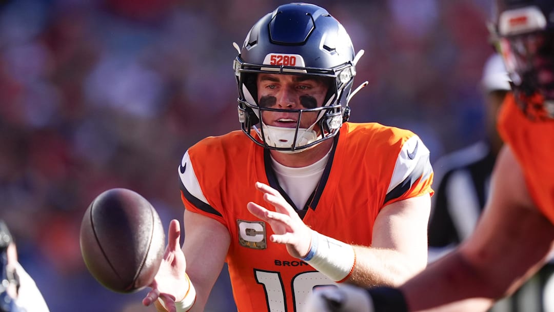 Nov 16, 2025; Denver, Colorado, USA;  Denver Broncos quarterback Bo Nix (10) takes the snap during the first quarter of the game against the Kansas City Chiefs at Empower Field at Mile High. 