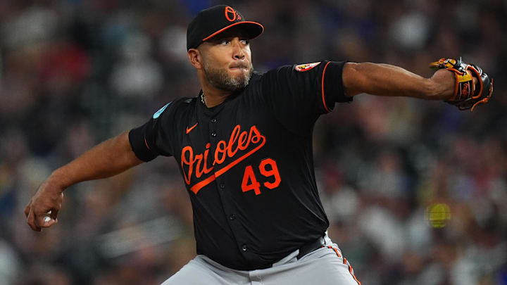 Aug 30, 2024; Denver, Colorado, USA; Baltimore Orioles starting pitcher Albert Suarez (49) delivers a pitch the sixth inning against the Colorado Rockies at Coors Field.