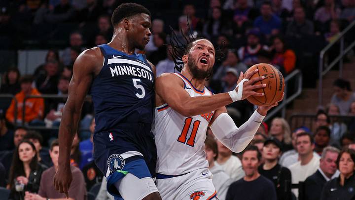 Oct 13, 2024; New York, New York, USA; New York Knicks guard Jalen Brunson (11) is fouled by Minnesota Timberwolves guard Anthony Edwards (5) during the first half at Madison Square Garden. Mandatory Credit: Vincent Carchietta-Imagn Images