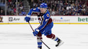 Jan 14, 2025; Denver, Colorado, USA; Colorado Avalanche right wing Mikko Rantanen (96) shoots the puck in the second period against the New York Rangers at Ball Arena. Mandatory Credit: Ron Chenoy-Imagn Images