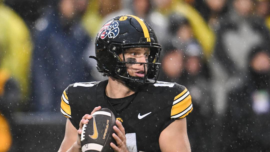 Nov 8, 2025; Iowa City, Iowa, USA; Iowa Hawkeyes quarterback Mark Gronowski (11) prepares to throw a pass against the Oregon Ducks during the first quarter at Kinnick Stadium. Mandatory Credit: Jeffrey Becker-Imagn Images