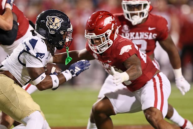 Arkansas linebacker Chris Paul Jr. makes a tackle against Florida International in 2023.