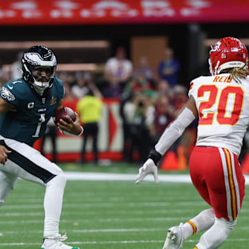 Feb 9, 2025; New Orleans, LA, USA; Philadelphia Eagles quarterback Jalen Hurts (1) runs with the ball as Kansas City Chiefs safety Justin Reid (20) chases during Super Bowl LIX at Caesars Superdome. Mandatory Credit: Geoff Burke-Imagn Images
