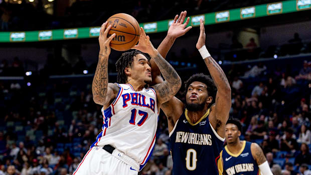 Keion Brooks tries to stop Philadelphia 76ers guard Jalen Hood-Schifino in their game in New Orleans. 