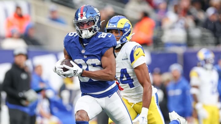 Dec 31, 2023; East Rutherford, New Jersey, USA; New York Giants wide receiver Darius Slayton (86) catches a touchdown pass during the second half as Los Angeles Rams cornerback Ahkello Witherspoon (44) defends at MetLife Stadium. Mandatory Credit: Vincent Carchietta-USA TODAY Sports