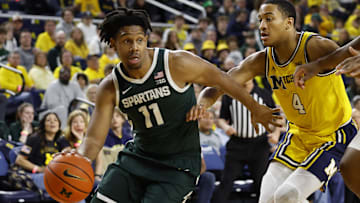 Feb 17, 2024; Ann Arbor, Michigan, USA;  Michigan State Spartans guard A.J. Hoggard (11) dribbles
