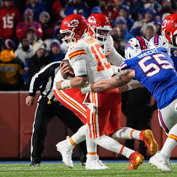 Nov 2, 2025; Orchard Park, New York, USA; Kansas City Chiefs quarterback Patrick Mahomes (15) is brought down by Buffalo Bills defensive end Michael Hoecht (55)