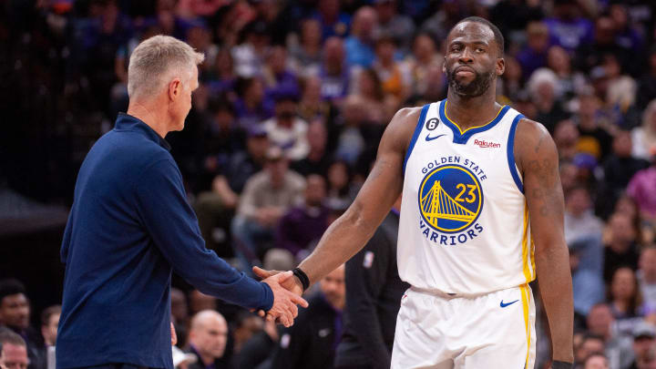 Golden State Warriors head coach Steve Kerr congratulates forward Draymond Green (23) during the fourth quarter of the game against the Sacramento Kings.