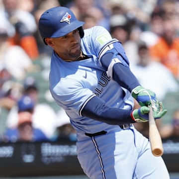 Jul 27, 2025; Detroit, Michigan, USA;  Toronto Blue Jays outfielder George Springer (4) hits a single in the third inning against the Detroit Tigers at Comerica Park. 