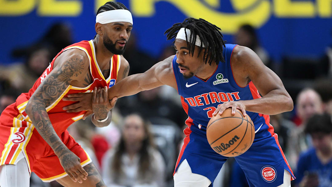 Dec 12, 2025; Detroit, Michigan, USA; Detroit Pistons guard Jaden Ivey (23) looks to dribble past Atlanta Hawks guard Nickeil Alexander-Walker (7) in the fourth quarter at Little Caesars Arena. Mandatory Credit: Lon Horwedel-Imagn Images