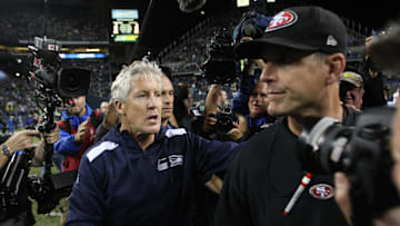  Head Coach Jim Harbaugh of the San Francisco 49ers shakes hands with Head Coach Pete Carroll of the Seattle Seahawks on the field following the game at CenturyLink Field on September 15, 2013 in Seattle, Washington. The Seahawks defeated the 49ers 29-3. 