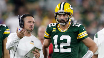 Green Bay Packers head coach Matt LaFleur talks with quarterback Aaron Rodgers (12) in between quarters against the Chicago Bears during their game on Sep 18, 2022, in Green Bay, Wisconsin.