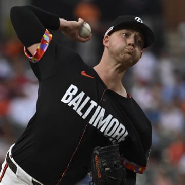 Jun 14, 2024; Baltimore, Maryland, USA; Baltimore Orioles pitcher Kyle Bradish (38) throws a first inning pitch against the Philadelphia Phillies at Oriole Park at Camden Yards.
