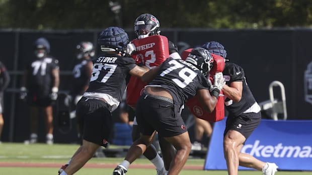 Jul 24, 2025; Houston, TX, USA; Houston Texans tight end Cade Stover (87) and Houston Texans Aireontae Ersery (79) during tra
