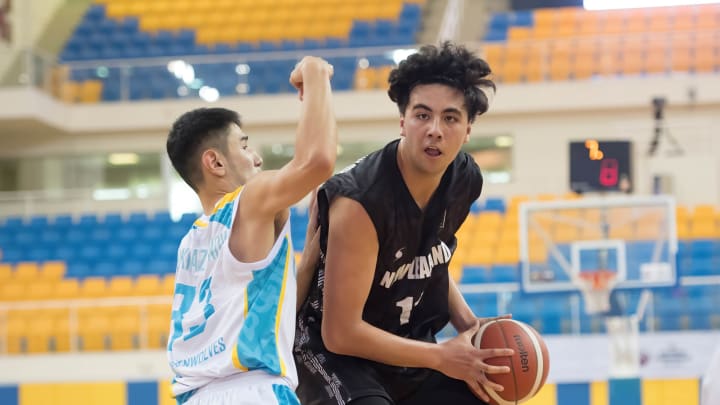 Akhan Mukhazhanov (L) of Kazakhstan Basketball team and...