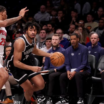 Dec 23, 2023; Brooklyn, New York, USA; Brooklyn Nets guard Cam Thomas (24) controls the ball against Detroit Pistons guard Marcus Sasser (25) during the first quarter at Barclays Center. Mandatory Credit: Brad Penner-USA TODAY Sports