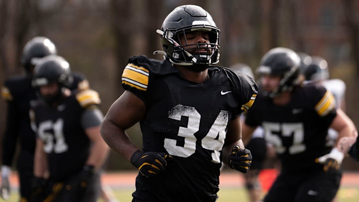 Iowa Hawkeye’s Jay Higgins runs during the team’s practice at Ensworth School in Nashville, Tenn., Friday, Dec. 27, 2024.