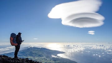 A hiker is seen exploring the Pico mountain, in the Azores...