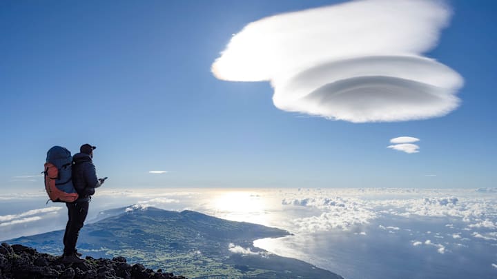 A hiker is seen exploring the Pico mountain, in the Azores...