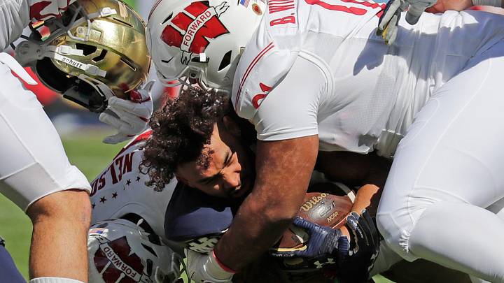 Notre Dame Fighting Irish running back Kyren Williams (23) loses his helmet as he is brought down by Wisconsin Badgers linebacker nose tackle Bryson Williams (91) during their football game Saturday, September 25, 2021, at Soldier Field in Chicago, Ill. Dan Powers/USA TODAY NETWORK-Wisconsin