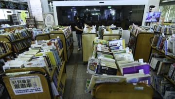 A librarian seen sorting books on  bookshelves in Taipei...
