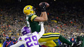 Green Bay Packers wide receiver Allen Lazard (13) pulls down a touchdown reception against Minnesota Vikings defensive back Kris Boyd (29) in the second quarter during their football game Sunday, January 2, 2022, at Lambeau Field in Green Bay, Wis.